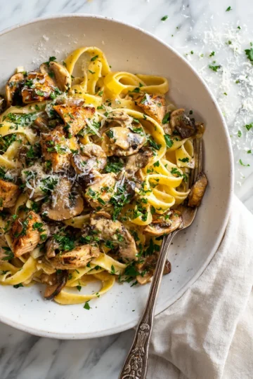 Delicious Chicken and Mushroom Pasta in creamy sauce, perfect for cozy dinners.