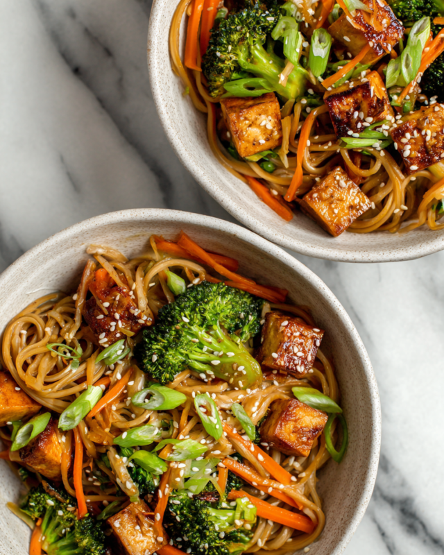 Vibrant Healthy Noodle Bowls with tofu and mixed vegetables for a quick meal.