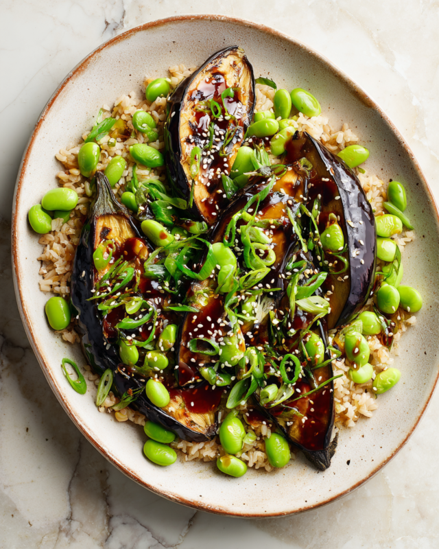 Miso Aubergine with Edamame Beans and Brown Rice, a hearty vegan dish ideal for fall gatherings.
