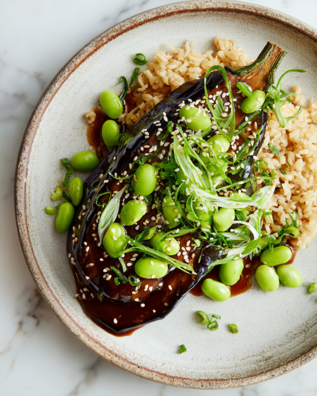 Miso Aubergine with Edamame Beans and Brown Rice, a hearty vegan dish ideal for fall gatherings.