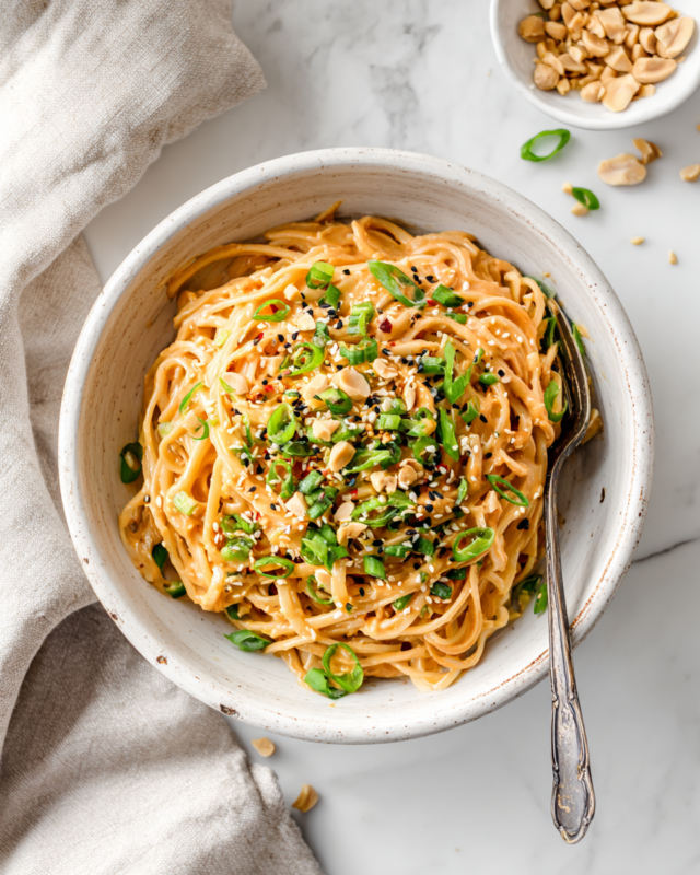 Quick and Flavorful Spicy Peanut Butter Noodles Delicious spicy peanut butter noodles ready in 10 minutes, perfect for quick meals with customizable ingredients.