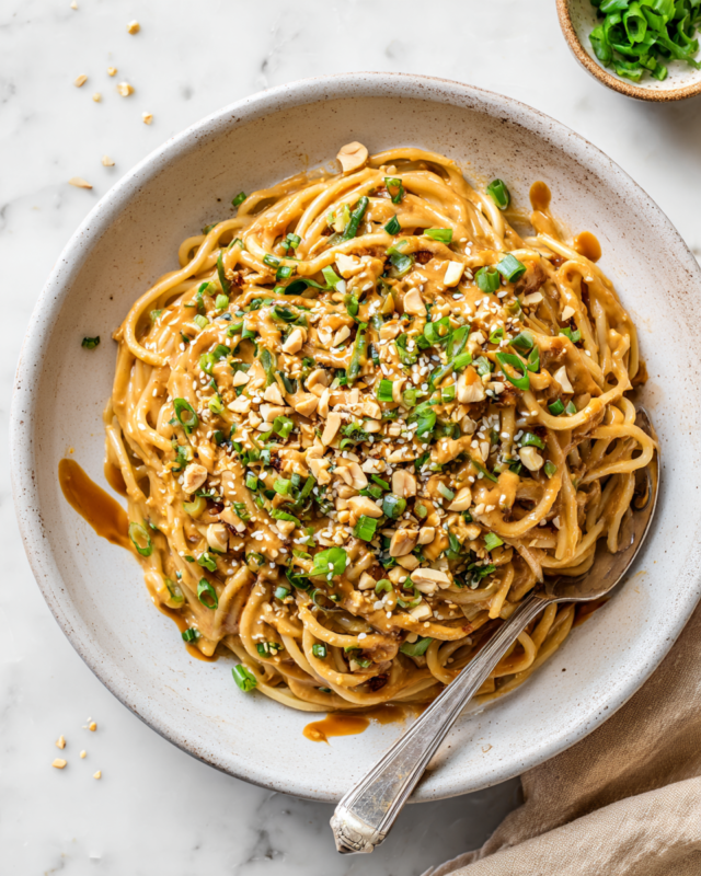 Quick and Flavorful Spicy Peanut Butter Noodles Delicious spicy peanut butter noodles ready in 10 minutes, perfect for quick meals with customizable ingredients.