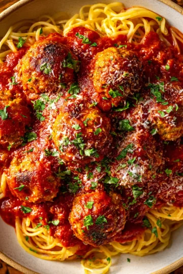 Comforting Meatballs in Tomato Sauce Delicious meatballs in a rich tomato sauce served with pasta. Perfect comfort food for autumn gatherings. Easy to make ahead and freeze.